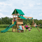 Canyon Creek All Cedar Swing Set Playset w/ Rockwall Upper Fort Belt Swings Web Swing Gray Wave Slide, and Play Kitchen - Image 8